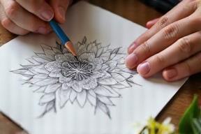 Close up of a florist sketching a bespoke bouquet design on paper